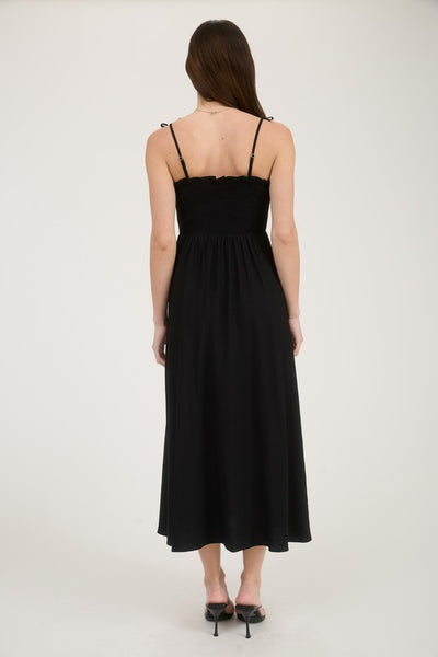 Woman wearing a black dress on a white background