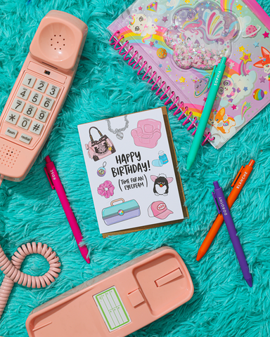 Birthday card with stationery items on a turquoise textured surface