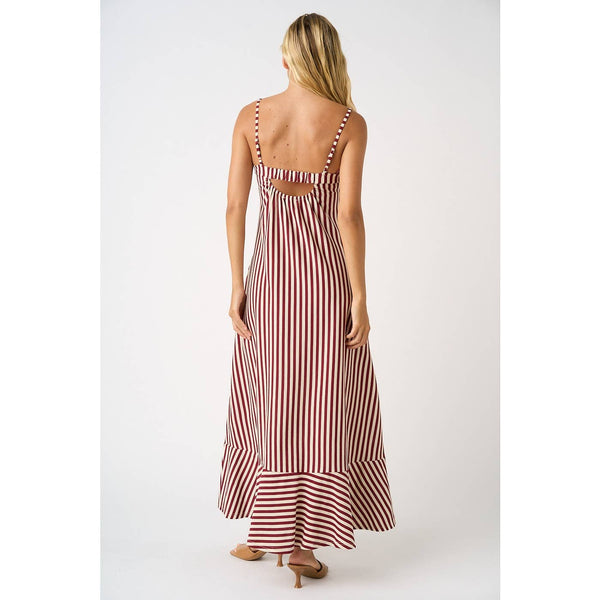 Woman wearing a red and white striped dress on a white background