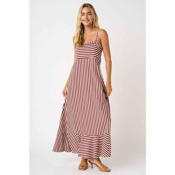 Woman wearing a red and white striped dress on a white background