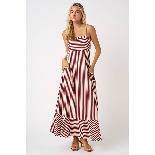 Woman wearing a red and white striped dress on a white background