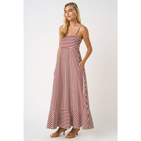 Woman wearing a red and white striped dress on a white background