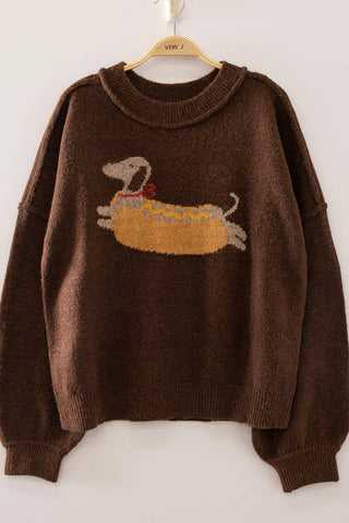 Brown sweater with a dog design on a hanger against a white background