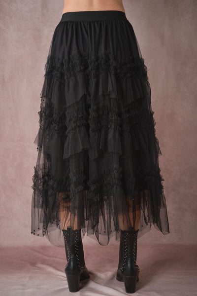 Black tiered skirt with lace details on a plain background