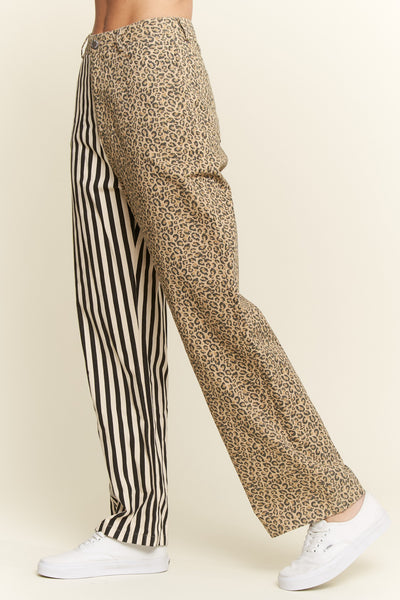 Leopard print and striped pants worn by a person on a beige background