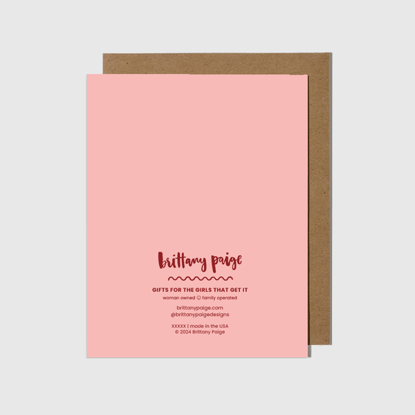 Pink card with brown envelope on a white background
