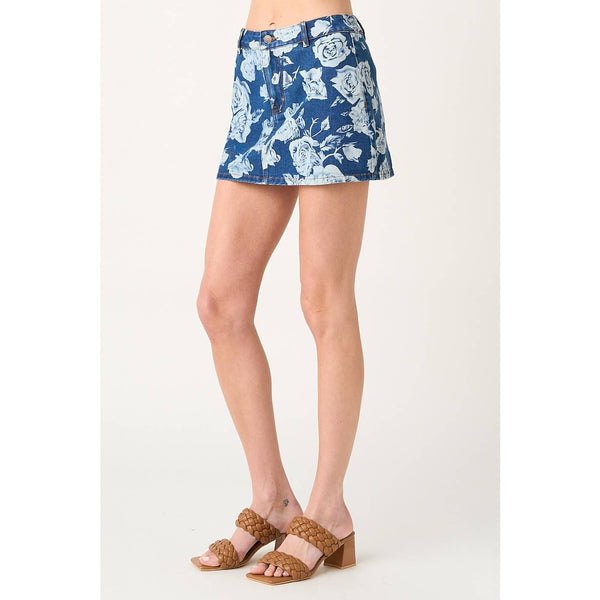 Blue floral skirt worn by a person on a white background