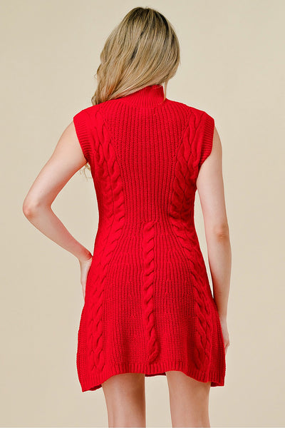 Red knitted dress worn by a person on a beige background