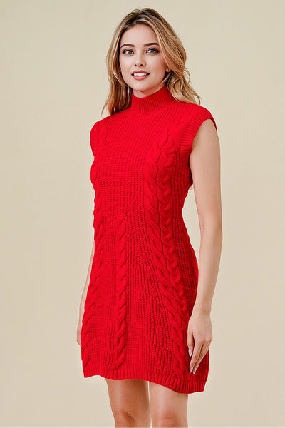 Woman wearing a red cable knit dress against a beige background