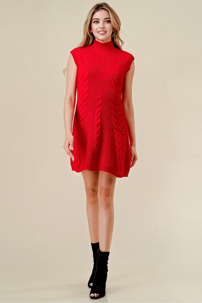 Woman wearing a red sleeveless dress against a beige background