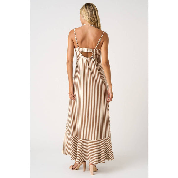 Woman wearing a striped dress with cut-out back on a white background