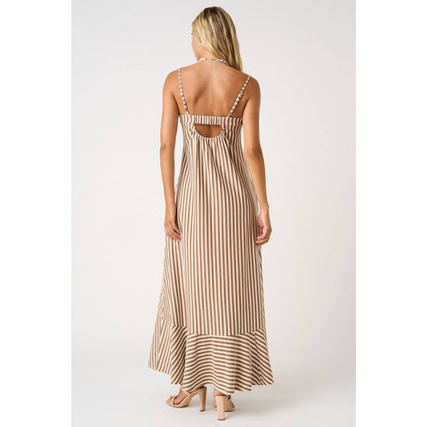 Woman wearing a striped dress with cut-out back on a white background