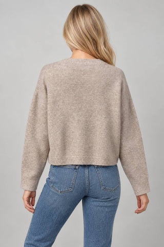 Women’s knit cardigan with playful dog face motifs, button front, and ribbed trim