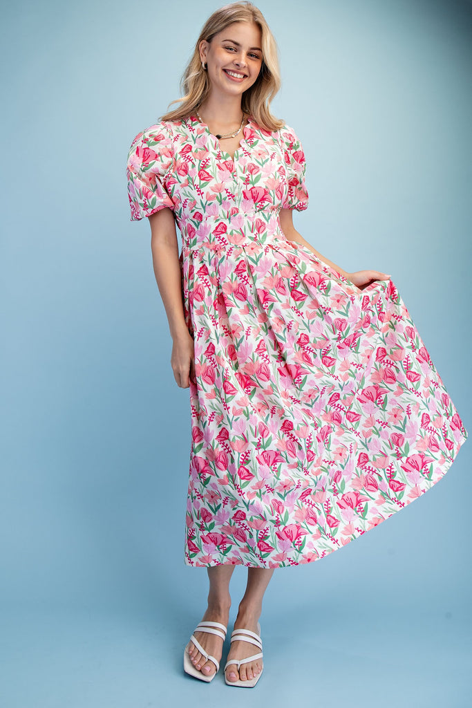 Woman wearing a floral dress on a light blue background