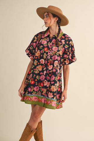 Woman wearing a floral dress and hat on a beige background