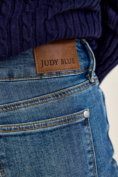 Close-up of blue jeans with a Judy Blue label.
