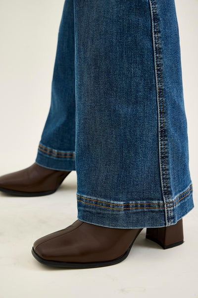 Judy Blue women's petite high-waisted flare jeans in a medium blue wash featuring a double-button tummy control waistband and 30-inch inseam.