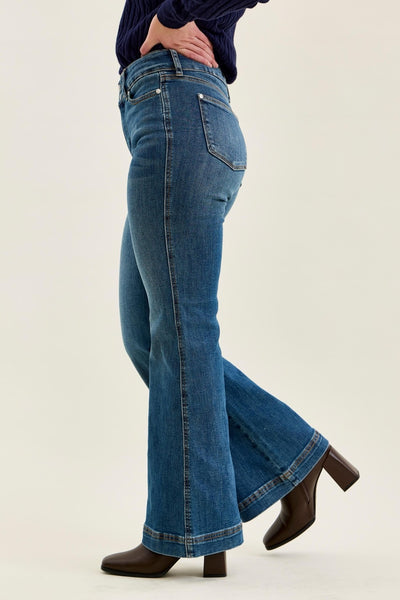 Judy Blue women's petite high-waisted flare jeans in a medium blue wash featuring a double-button tummy control waistband and 30-inch inseam.