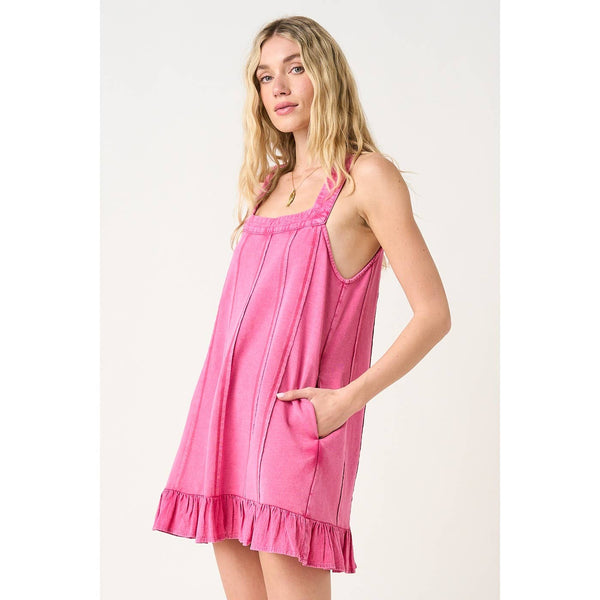 Woman wearing a pink dress against a white background