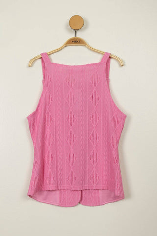 Pink knitted tank top on a wooden hanger against a beige background