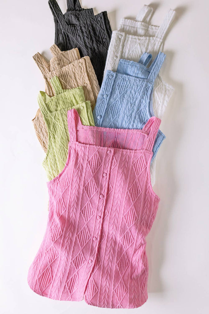 Stack of colorful overalls on a white background