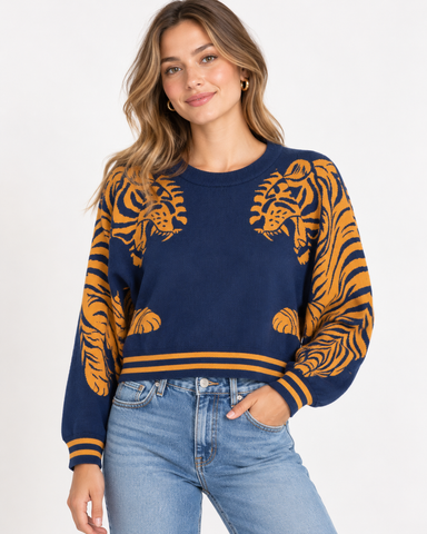 Women’s navy blue knit sweater with golden mustard tiger graphics and striped trim